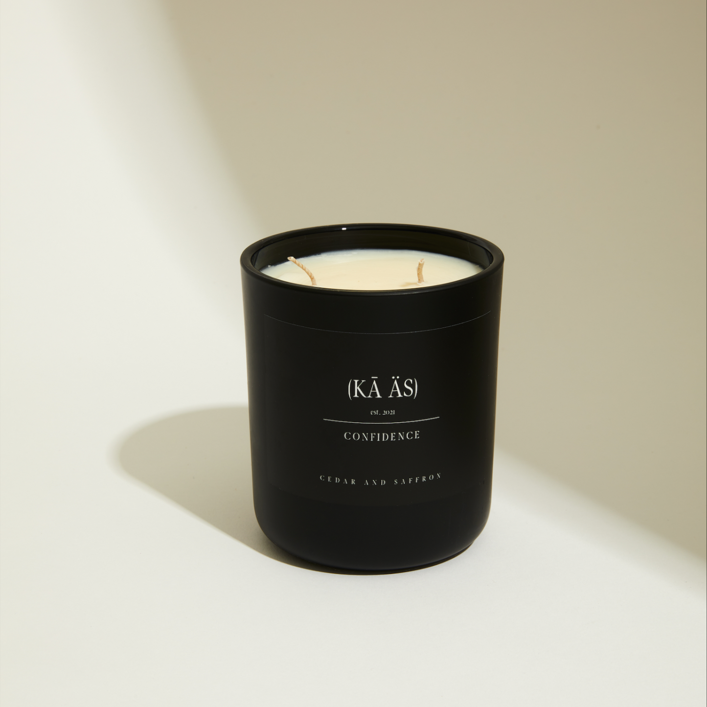 Cedar and saffron in a matte black vessel. confidence scented candle