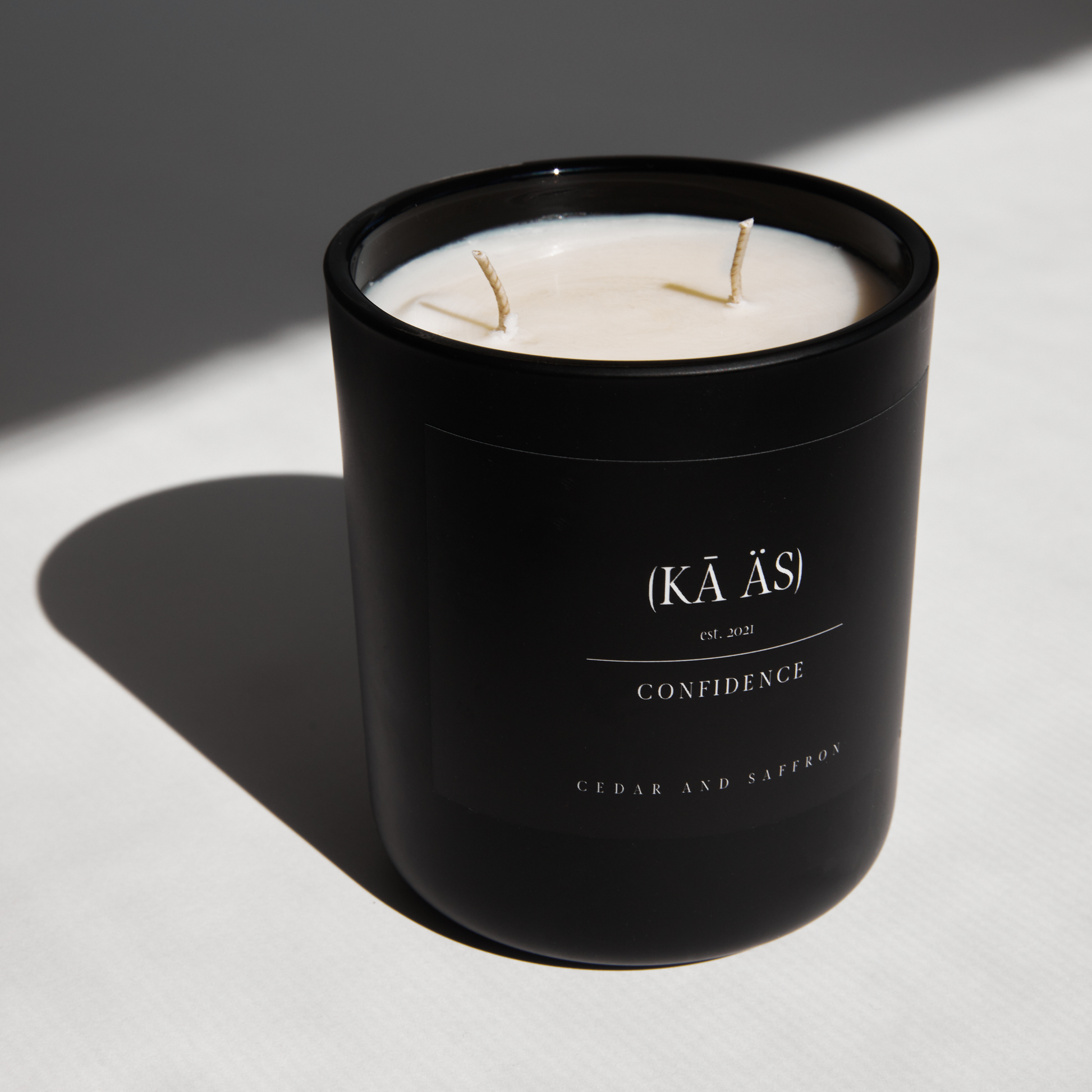 Cedar and saffron in a matte black vessel. confidence scented candle