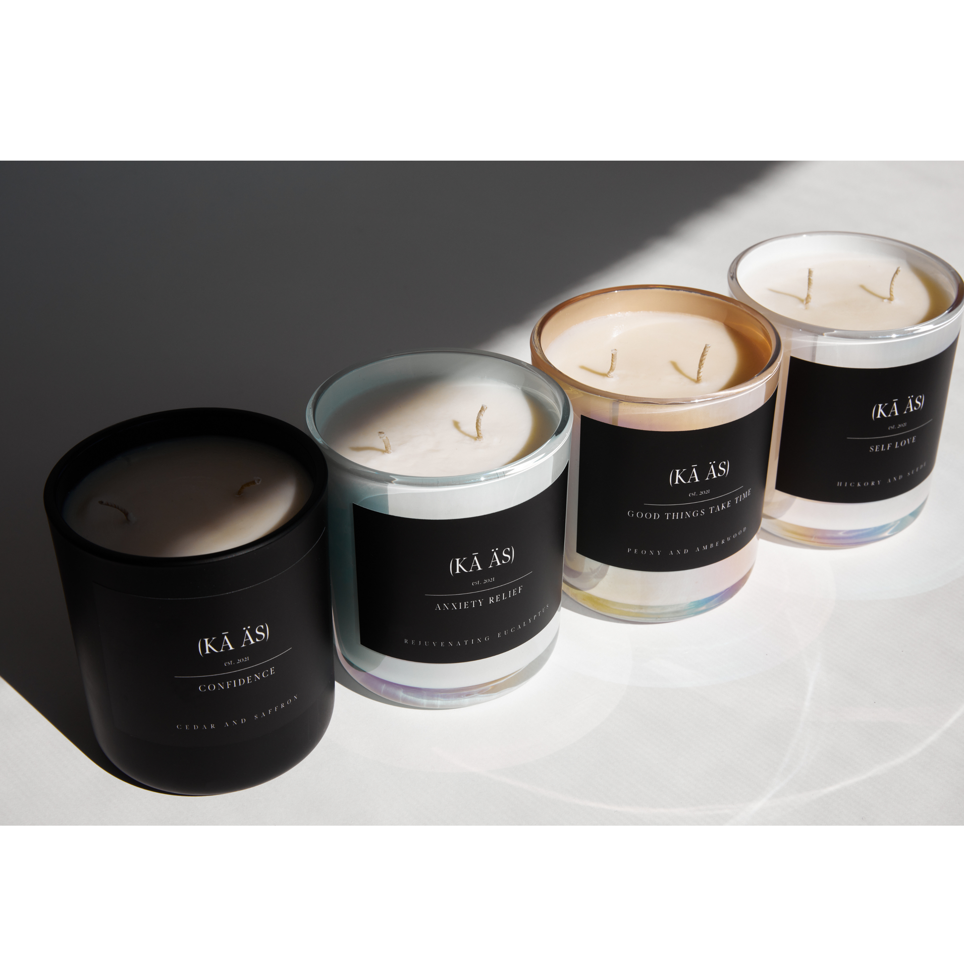 self love, hickory and suede scented candles iridescent white vessel